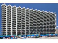 Beautiful exterior view of this oceanfront building with private balconies and ocean views at 1210 N Waccamaw Dr. # 408, Garden City Beach, SC 29576
