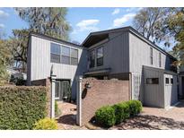 Charming two-story home with a brick courtyard, mature landscaping, and inviting entryway at 135 Chapel Creek Rd. # 41, Pawleys Island, SC 29585