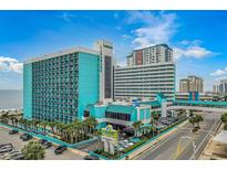 Turquoise landmark resort hotel with palm trees, parking, and street view at 1501 S Ocean Blvd. # 1042, Myrtle Beach, SC 29577
