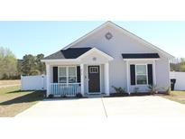 Charming single-story home featuring a cozy front porch and well-maintained landscaping at 2519 Southern Crest Dr., Loris, SC 29569