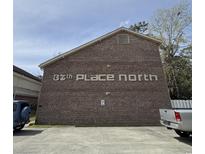 Apartment building exterior showing brick facade and signage, 37th Place North, parking available at 515 37Th Ave. N # 101, Myrtle Beach, SC 29572
