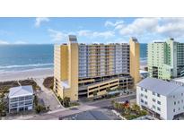 Beautiful beachfront condo building with multi-level parking and ocean views at 5404 N Ocean Blvd. N # 6-E, North Myrtle Beach, SC 29582