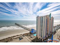 Beautiful ocean front building with a shared outdoor pool, pier, and beach access at 3500 N Ocean Blvd. # 1203, North Myrtle Beach, SC 29582