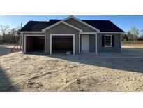 Charming single-story home with two-car garage and unfinished landscaping at 1498 Hardwick Rd., Conway, SC 29526