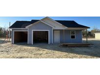 New construction home with an attached two-car garage and covered porch at 1502 Hardwick Rd., Conway, SC 29526