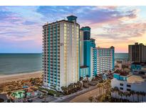 Oceanfront resort with a large pool, beach access, and multiple floors of condo units at 3000 N Ocean Blvd. # 130, Myrtle Beach, SC 29577