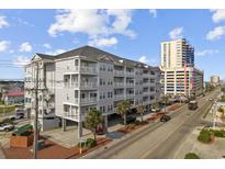 Beautiful condo building with multiple balconies offering stunning views of the ocean and surrounding area at 3401 Ocean Blvd. N # 103, North Myrtle Beach, SC 29582