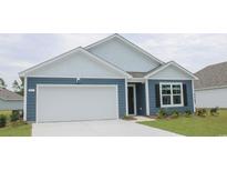 Charming one-story home featuring blue siding, a two-car garage, and a well-maintained front yard with green grass at 5163 Yellowstone Dr., Conway, SC 29526
