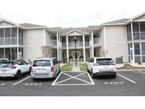 Attractive condo building featuring double balconies, convenient parking and a well-maintained exterior at 6204 Sweetwater Blvd. # 6204, Murrells Inlet, SC 29576