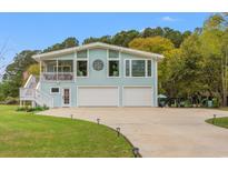 Charming two-story home with a spacious driveway and two-car garage at 67 Kingsbury Pl., Georgetown, SC 29440