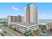 Beautiful Palace Resort condo featuring an ocean view, a pool and outdoor lounging at 1605 S Ocean Blvd. # 1114, Myrtle Beach, SC 29577
