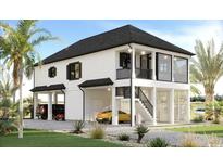 Stunning raised beach home with a modern design and lush landscaping at 196 Brown Pelican Loop, Pawleys Island, SC 29585