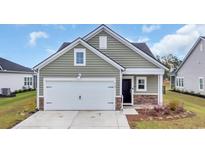 Charming one-story home features a garage and black front door with stone veneer accent at 4105 Da Vinci Dr., Myrtle Beach, SC 29579