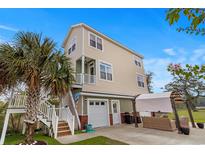 Charming home featuring a private balcony, pergola, and ample parking with a well manicured lawn at 4387 Landing Rd., Little River, SC 29566