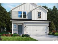 Charming two-story home with a white garage door and landscaped front yard at 4823 Hopespring St., Myrtle Beach, SC 29579