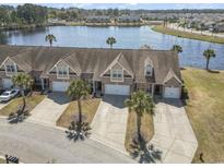 Beautiful waterfront townhomes with attached garages, mature landscaping and stunning lake views at 5012 Prato Loop # 5012, Myrtle Beach, SC 29579