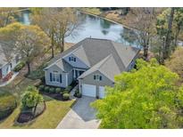 Beautiful single-Gathering home with a well-manicured lawn and situated on a picturesque waterfront property at 742 Camden Circle, Pawleys Island, SC 29585