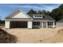 New construction home with a 2-car garage, gray roof, and white siding at 1395 Knotty Branch Rd., Conway, SC 29527