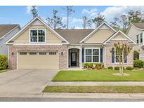 Charming brick home with a manicured lawn, attached garage, and inviting front entrance at 1478 Suncrest Dr., Myrtle Beach, SC 29577