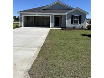 Charming single-Gathering home with well-manicured lawn and attached two-car garage at 33 Cape Point Dr., Conway, SC 29527