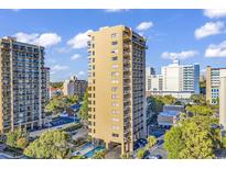 Beautiful exterior shot of a tall condo building with a pool, balconies, and city views at 201 75Th Ave N # 4065, Myrtle Beach, SC 29572