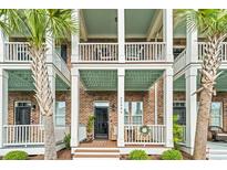 Charming townhouse with brick facade, multiple balconies, and welcoming entryway at 2790 Howard Ave. # D, Myrtle Beach, SC 29577