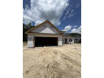 New construction home featuring a two-car garage and architectural details at 4028 Copperhead Rd., Conway, SC 29527