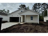 Charming new construction home with a light exterior and a covered front porch and attached garage at 1031 Laconic Dr., Myrtle Beach, SC 29588