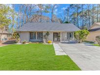 Charming single-story home featuring a well-manicured lawn and inviting curb appeal at 111 Hickory Dr., Conway, SC 29526