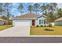 Charming one-story home featuring a well-manicured lawn, neutral siding, and an inviting red front door at 156 Teddy Bear Circle, Conway, SC 29526