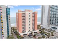 Stunning exterior shot of a beachfront condo building with multiple balconies and ocean views at 1604 N Ocean Blvd. # 904, Myrtle Beach, SC 29577
