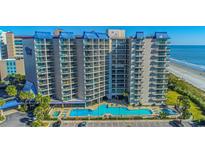 Oceanfront condo with a blue swimming pool, beach access, and convenient parking at 200 76Th Ave. N # 1211, Myrtle Beach, SC 29572