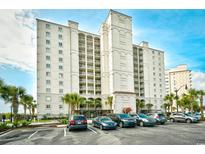 Beautiful condo building with palm trees, balconies, and ample parking for residents and guests at 2151 Bridge View Ct. # 1-702, North Myrtle Beach, SC 29582