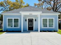 Charming single-story home featuring a modern exterior, manicured landscaping, and a welcoming entrance at 2604 Willow St., North Myrtle Beach, SC 29582