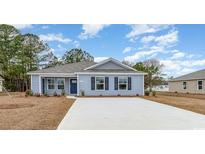 Charming single-story home with blue siding, a gray roof, and a well-maintained front yard at 620 Culmen Ct., Myrtle Beach, SC 29588