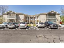 Exterior of condos with parking in front on a sunny day, great location at 6207 Sweetwater Blvd. # 6207, Murrells Inlet, SC 29576