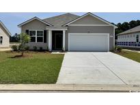 Charming single-story home with gray siding, an attached garage, and a well-maintained front lawn at 635 Culmen Ct., Myrtle Beach, SC 29588