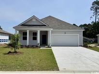 Charming single-story home with a two-car garage, well-manicured lawn, and inviting front porch at 643 Culmen Ct., Myrtle Beach, SC 29588