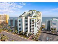 Beautiful exterior of Monterey Bay Suites featuring a parking area, street view, and nearby beach access at 6804 N Ocean Blvd. # 1127, Myrtle Beach, SC 29572
