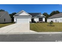 Charming one-story home boasting a well-manicured lawn and a classic white exterior at 933 Padgett Lane, Conway, SC 29526
