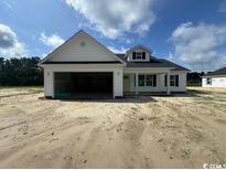 New construction of a single-story home featuring a covered front porch and attached garage at 384 William Nobles Rd., Aynor, SC 29511