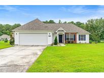Charming single-story home featuring a manicured lawn and attached two-car garage at 232 Marbella Dr., Murrells Inlet, SC 29576
