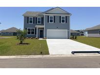 Charming two-story home with a well-manicured lawn and inviting curb appeal at 5171 Yellowstone Dr., Conway, SC 29526
