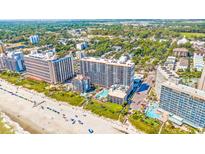 Expansive aerial view of beachfront resort property and coastline with pools and amenities at 7200 N Ocean Blvd. # 1053, Myrtle Beach, SC 29572