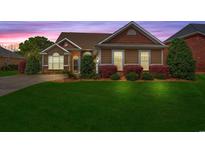 Charming single-story home featuring a manicured lawn and inviting curb appeal at 826 Sand Binder Dr., Myrtle Beach, SC 29579