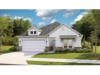 Charming single-Gathering home featuring a manicured lawn, two-car garage, and beautiful stone accents at 8711 Baton Rouge Ave Nw, Calabash, NC 28467