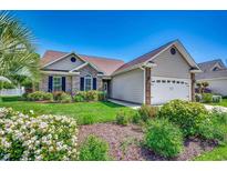 Charming single-Gathering home with a well-manicured lawn and mature landscaping at 109 Pheasant Run Dr., Murrells Inlet, SC 29576