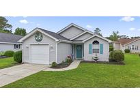 Charming one-story home featuring vinyl siding, a garage, and a well-maintained front lawn at 1130 Ganton Way, Myrtle Beach, SC 29588