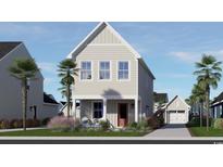 Charming two-story home with a peaked roof, landscaped yard, and a detached garage at 2833 Rowyn St., Longs, SC 29568