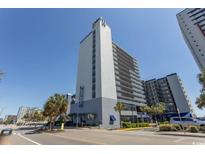 A lovely multi story building with a bright blue sky overhead and a sidewalk along the street at 2001 S Ocean Blvd. # 207, Myrtle Beach, SC 29577